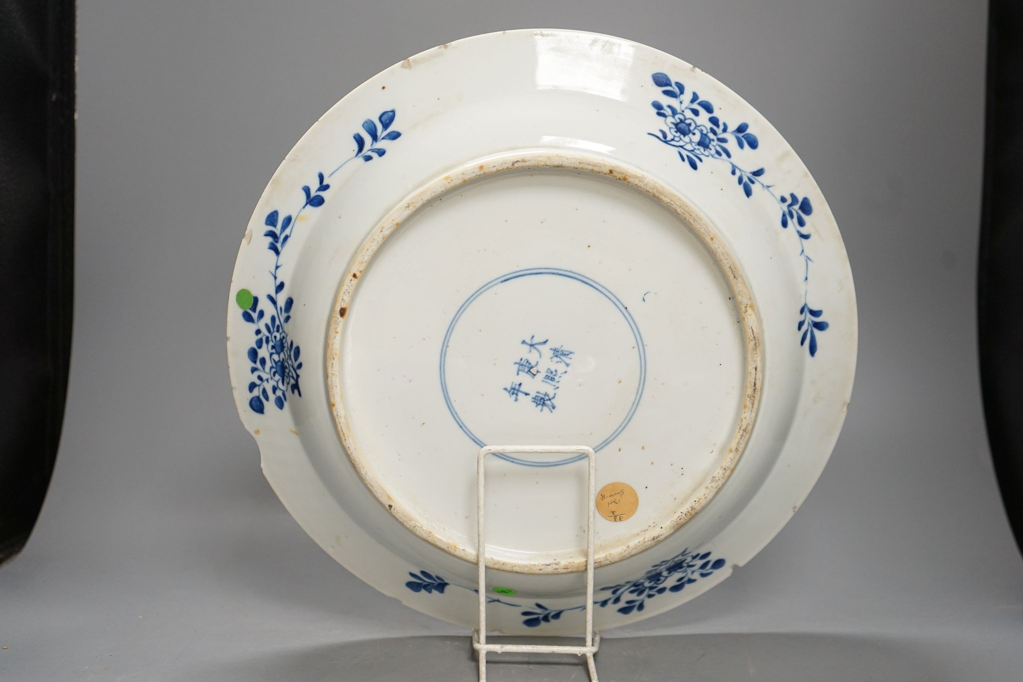 A Chinese blue and white landscape dish, Kangxi mark but 19th century, 36cm
